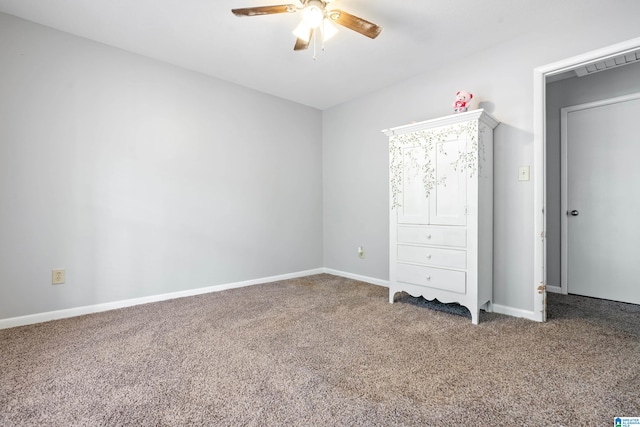 unfurnished bedroom featuring ceiling fan and carpet floors