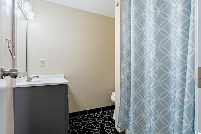 bathroom with vanity and toilet