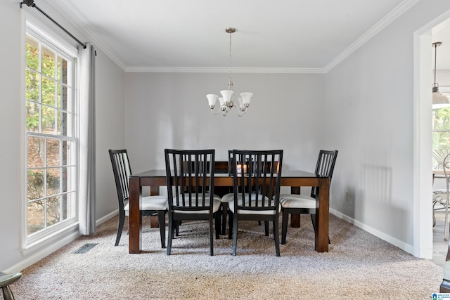 carpeted dining space featuring a notable chandelier and crown molding