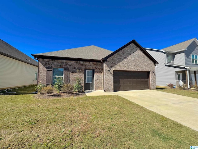 view of front of house with a garage and a front yard