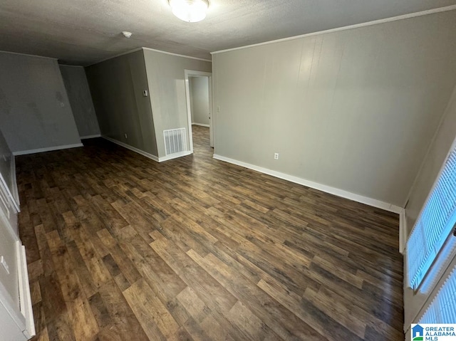 interior space with dark hardwood / wood-style floors and crown molding