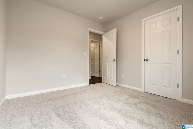 unfurnished bedroom featuring carpet