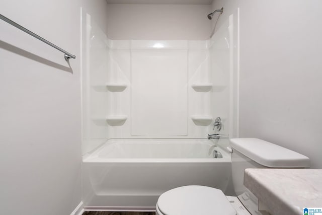 bathroom with toilet and shower / bathing tub combination