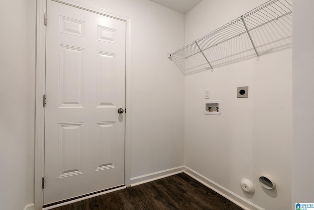 laundry room with dark hardwood / wood-style flooring, electric dryer hookup, hookup for a washing machine, and gas dryer hookup