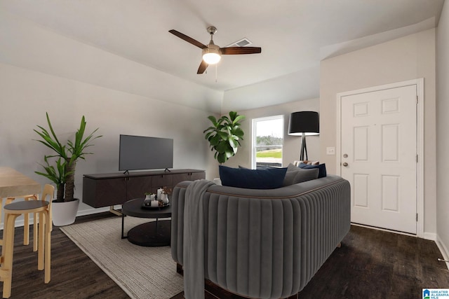 living room with ceiling fan and dark hardwood / wood-style floors