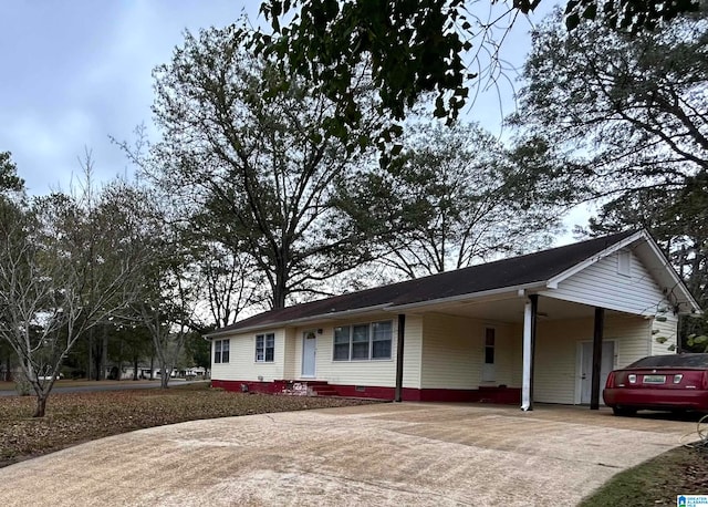 ranch-style home with a carport