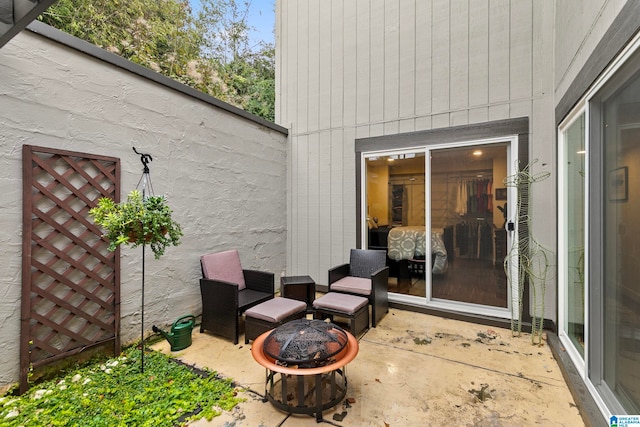 view of patio / terrace with an outdoor fire pit