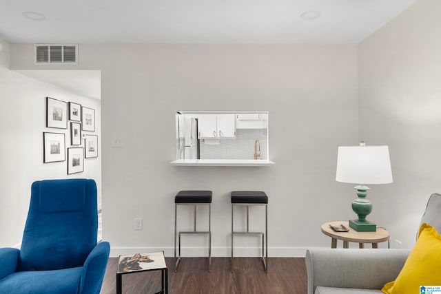 living area with dark hardwood / wood-style flooring