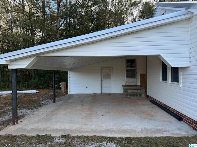 view of vehicle parking featuring a carport