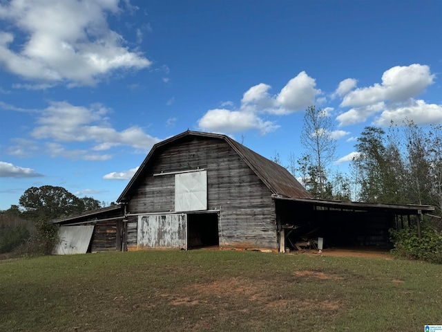 view of outbuilding with a lawn