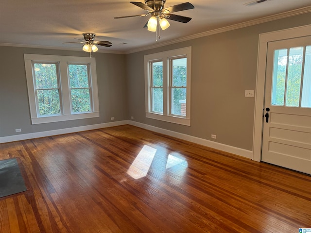 interior space with ornamental molding, hardwood / wood-style floors, and ceiling fan