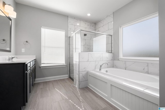 275 Avondale Ln, Pell City, AL 35128 - full bathroom featuring a bath, a stall shower, vanity, and baseboards