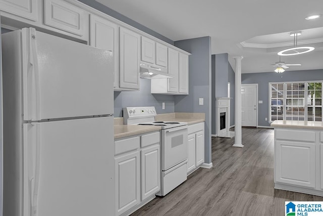 kitchen with exhaust hood, white cabinets, decorative columns, white appliances, and ceiling fan