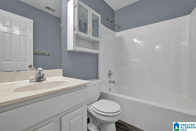 full bathroom featuring toilet, bathtub / shower combination, and vanity