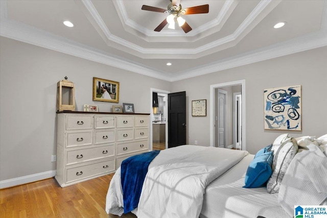 370 Pats Way, Springville, AL 35146 - bedroom with a tray ceiling, light wood finished floors, ornamental molding, a ceiling fan, and connected bathroom