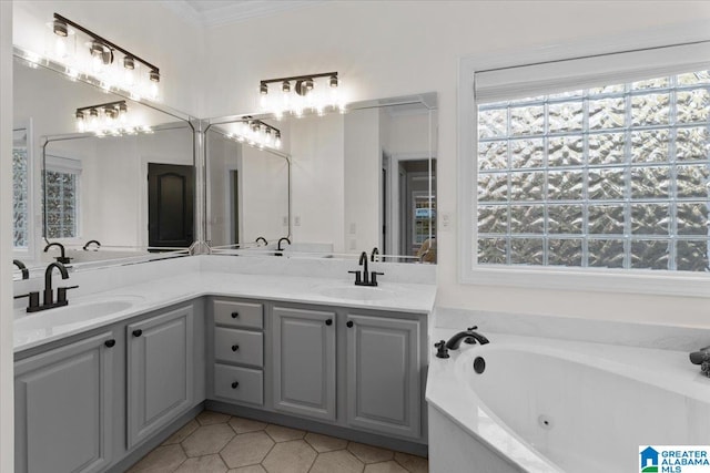 bathroom with vanity, a relaxing tiled tub, and ornamental molding