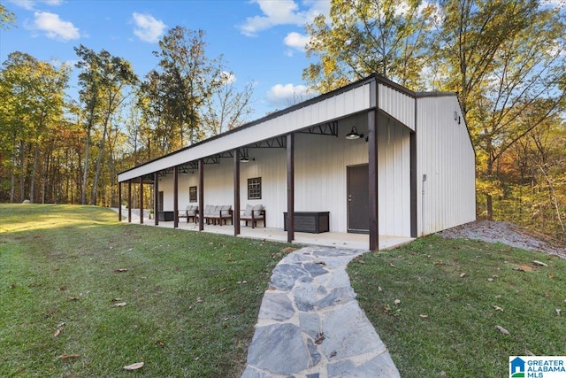 view of outbuilding with a lawn