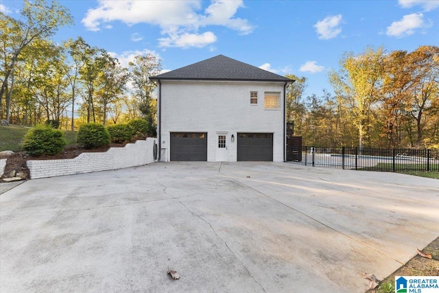 view of side of home with a garage