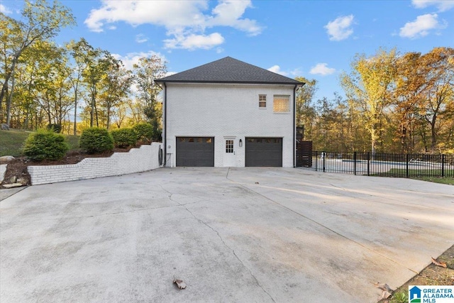 370 Pats Way, Springville, AL 35146 - view of side of property with a garage, fence, and driveway