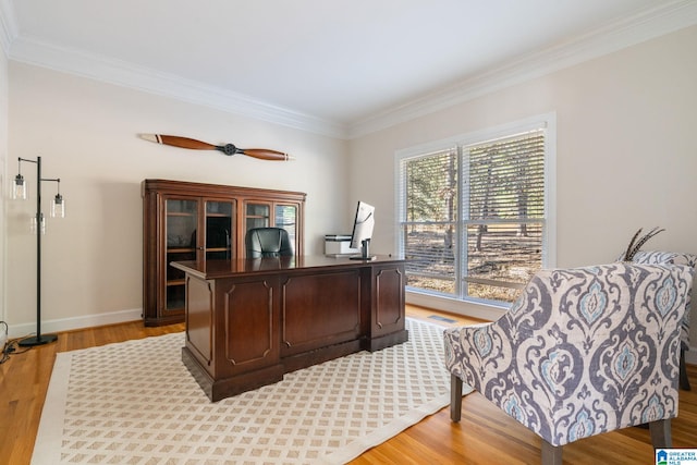 office area with hardwood / wood-style floors and ornamental molding