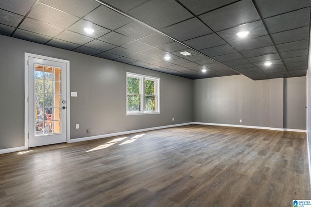 unfurnished room featuring a paneled ceiling and hardwood / wood-style flooring