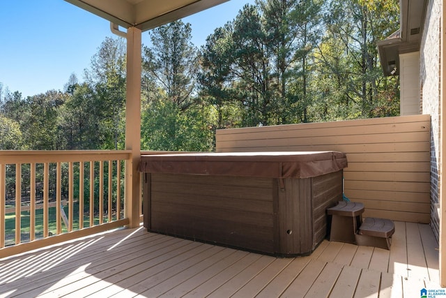 wooden terrace with a hot tub