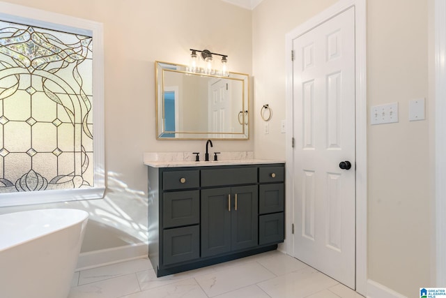 401 El Camino Real, Chelsea, AL 35043 - bathroom featuring baseboards, vanity, a freestanding bath, and marble look tiles