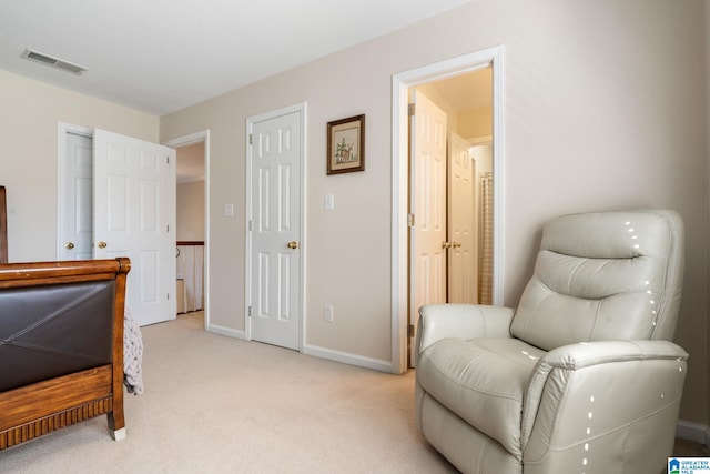 sitting room with light colored carpet