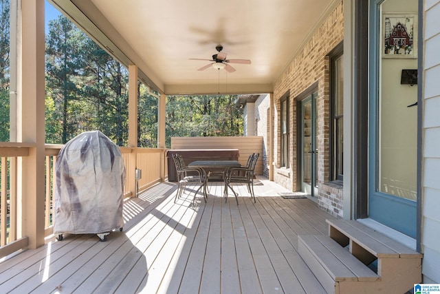 wooden terrace featuring ceiling fan