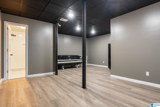 basement featuring light hardwood / wood-style floors