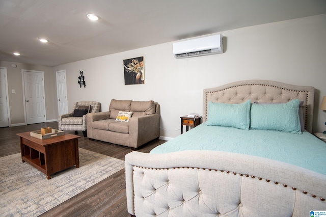 bedroom featuring dark wood-type flooring and a wall mounted AC