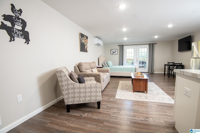 living room with dark wood-type flooring, french doors, and a wall mounted air conditioner