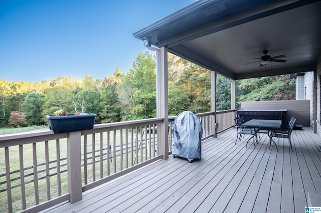 wooden terrace featuring ceiling fan