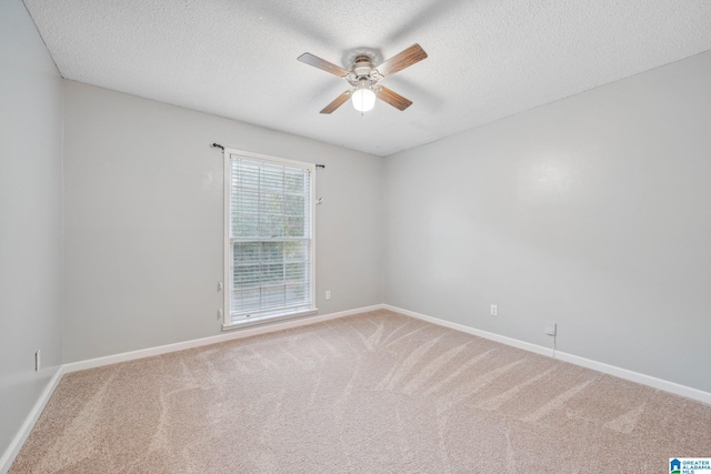 unfurnished room with carpet, a textured ceiling, and ceiling fan