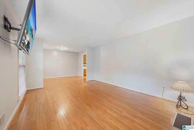 unfurnished living room with light wood-type flooring