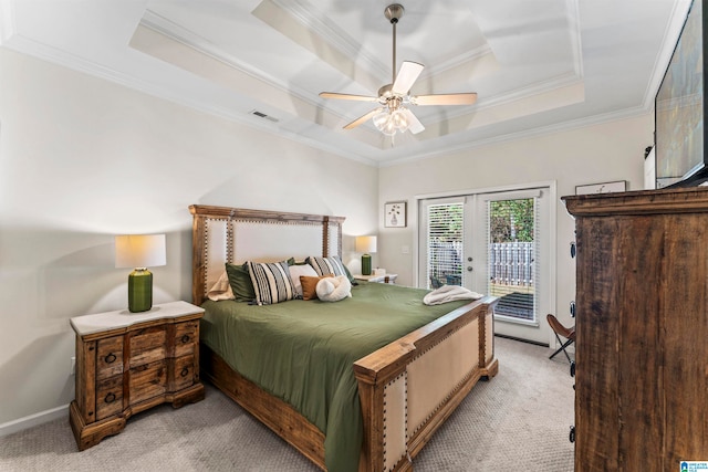 bedroom featuring access to exterior, french doors, ceiling fan, and a raised ceiling