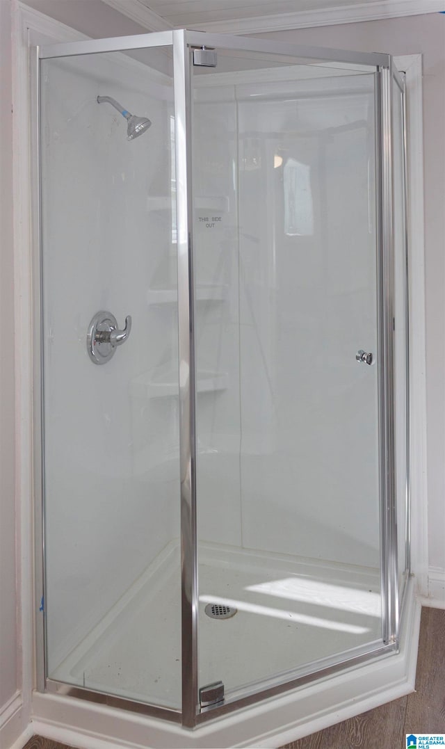 bathroom with a shower with shower door