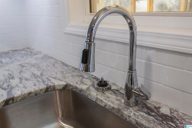 room details with sink and light stone countertops