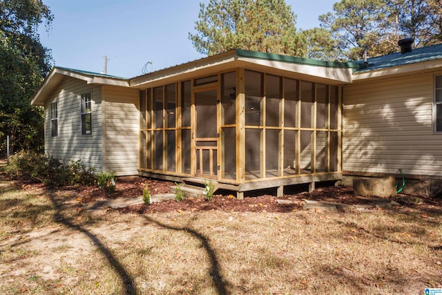 view of home's exterior featuring a sunroom