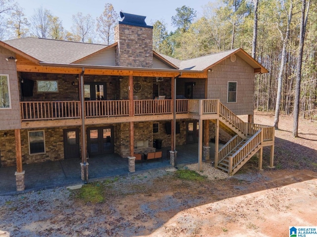 back of house featuring a patio, outdoor lounge area, and a deck