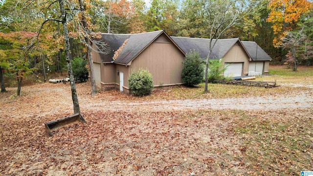 view of side of home featuring a garage