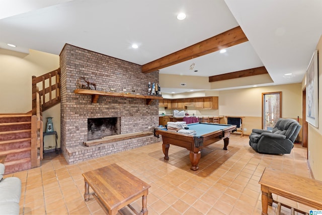 playroom with a brick fireplace, beamed ceiling, light tile patterned floors, and pool table