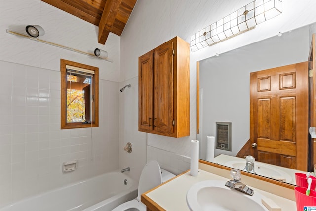 full bathroom with vanity, beam ceiling, toilet, tiled shower / bath, and wooden ceiling