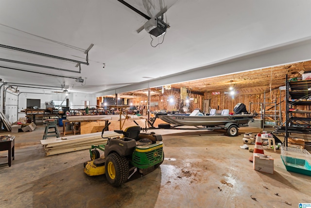 garage featuring a garage door opener and a workshop area