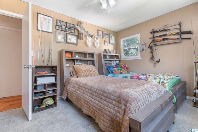 bedroom with light colored carpet and ceiling fan