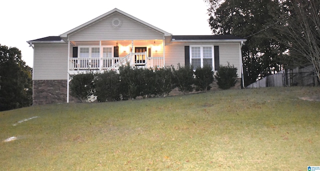 view of front facade with a porch and a front lawn