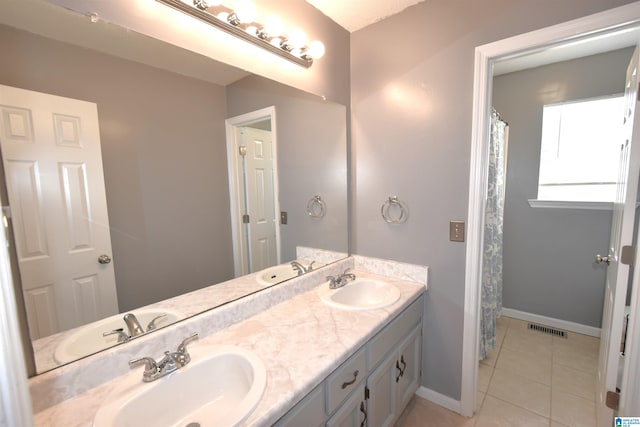 bathroom featuring vanity and tile patterned floors