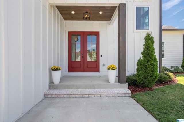 view of exterior entry featuring french doors