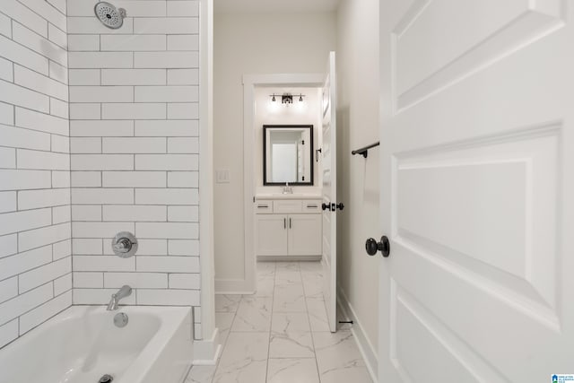 bathroom featuring vanity and tiled shower / bath combo