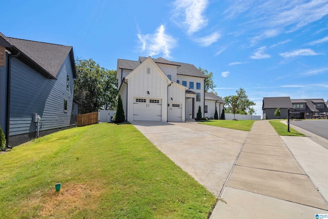 view of front facade with a garage and a front yard